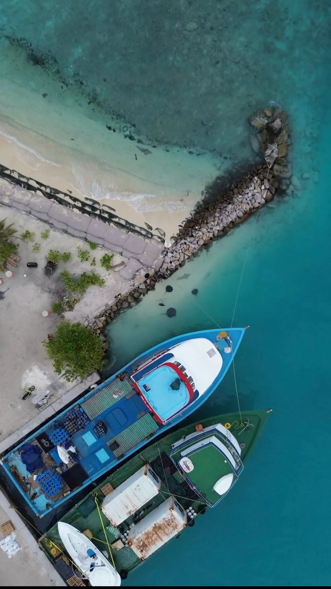 Boats moored at the island harbour, from above