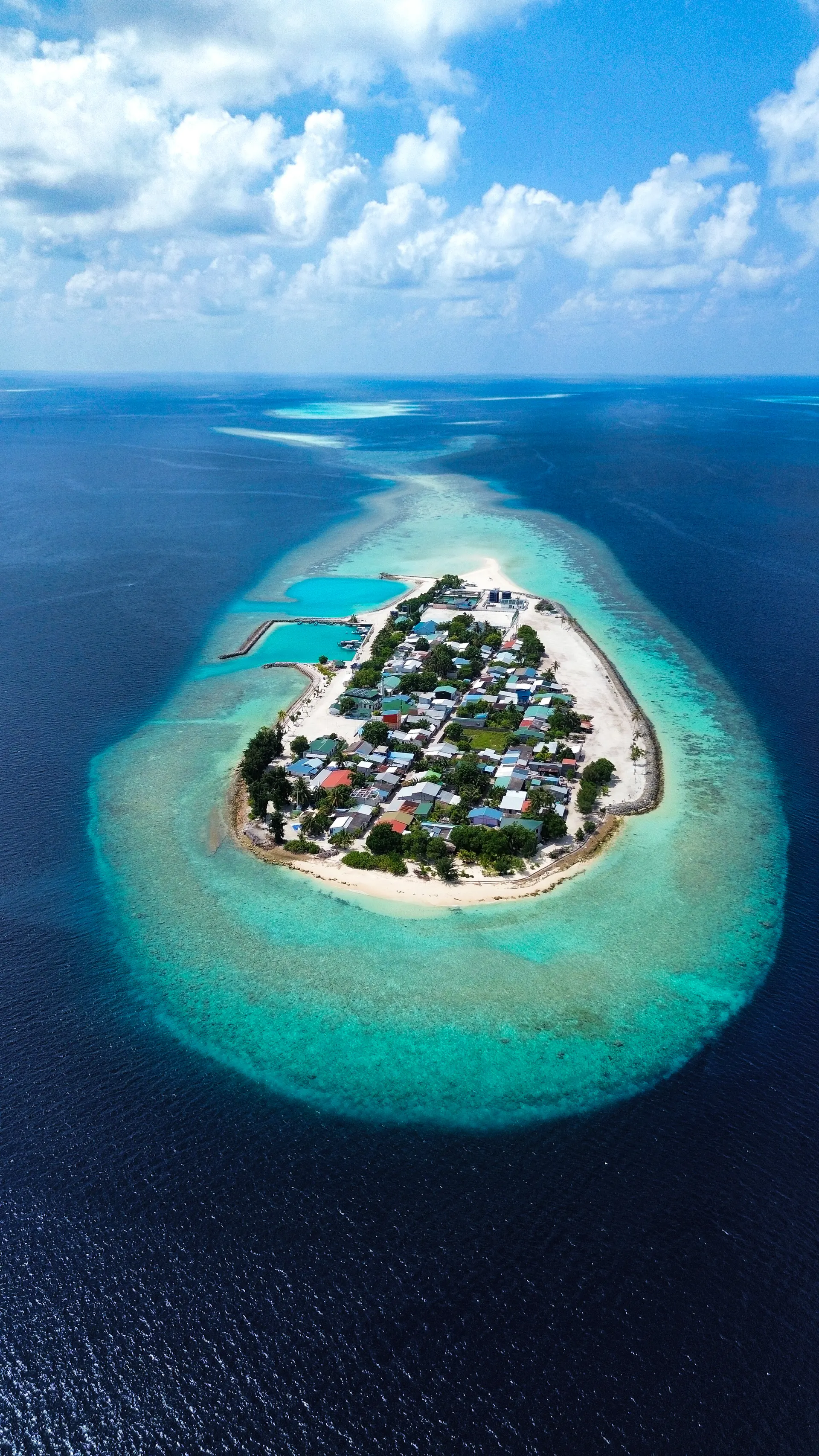 Kunburudhoo island ringed by reef, from the air