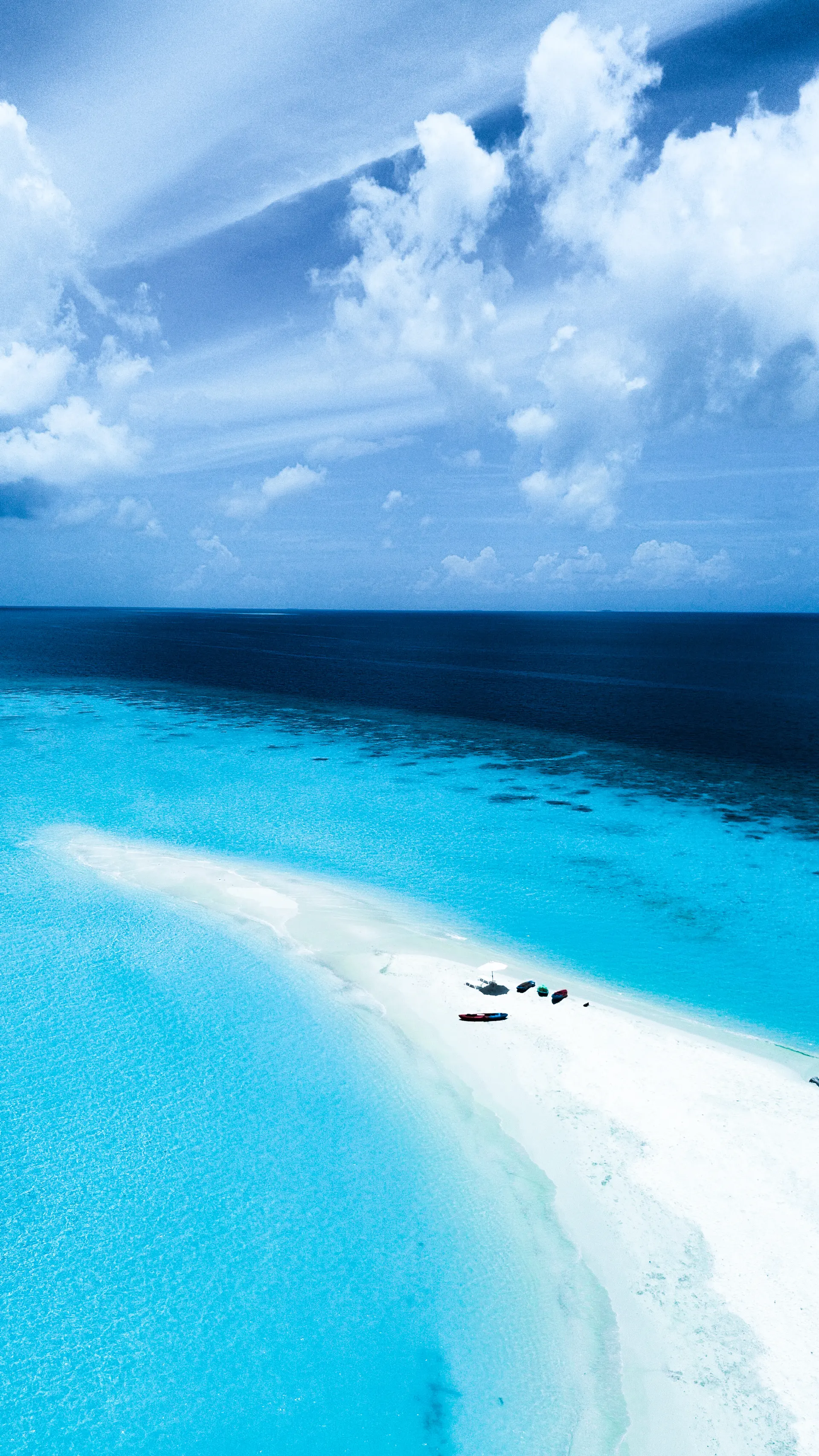 Long white sandbank in the open sea