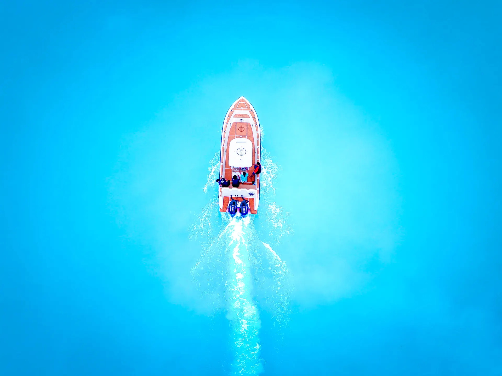 Speedboat crossing turquoise water