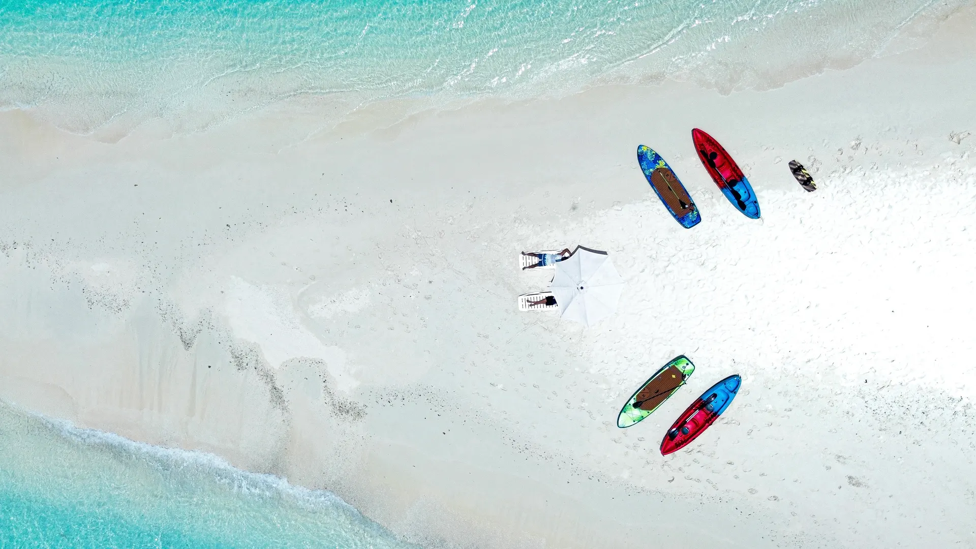 Kayaks and paddleboards on a sandbank